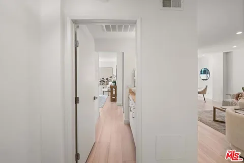 a view of a bedroom from a hallway