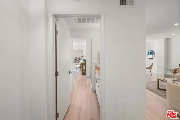 a view of a bedroom from a hallway