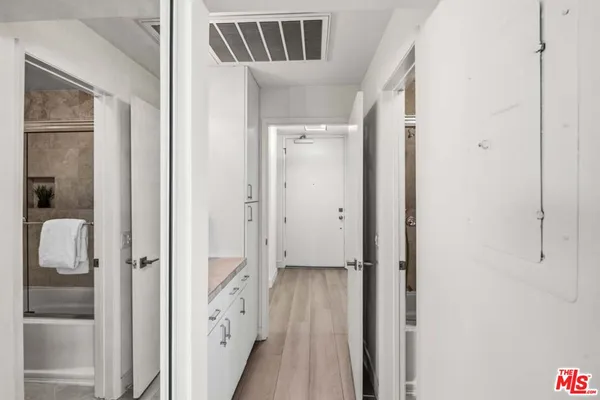 a view of an entryway with wooden floor