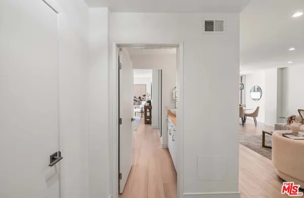 a view of a livingroom from a hallway