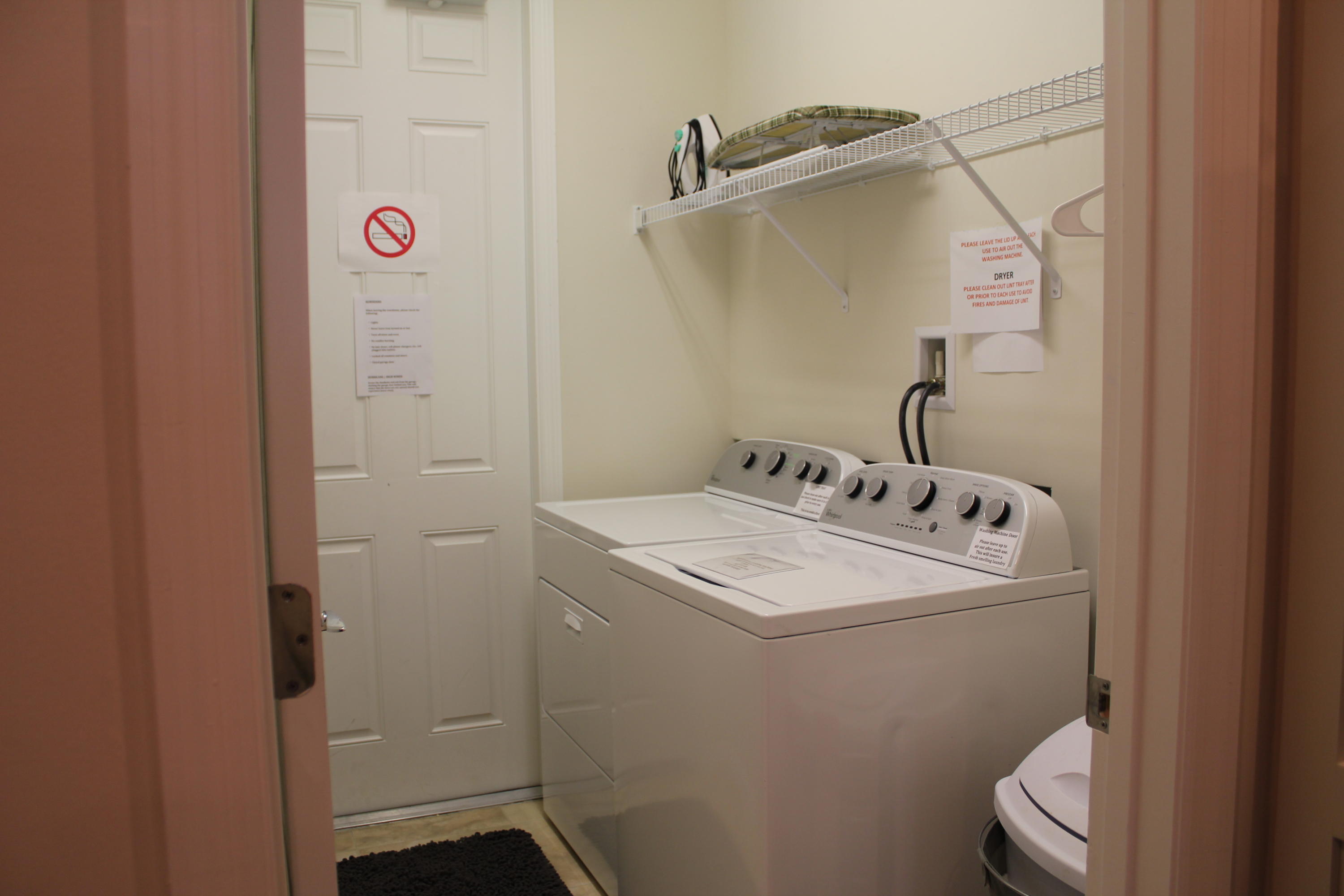 1168 South Community Drive Jupiter, FL 33458 - Photo 14 of 18 a bathroom with a sink and mirror with toilet