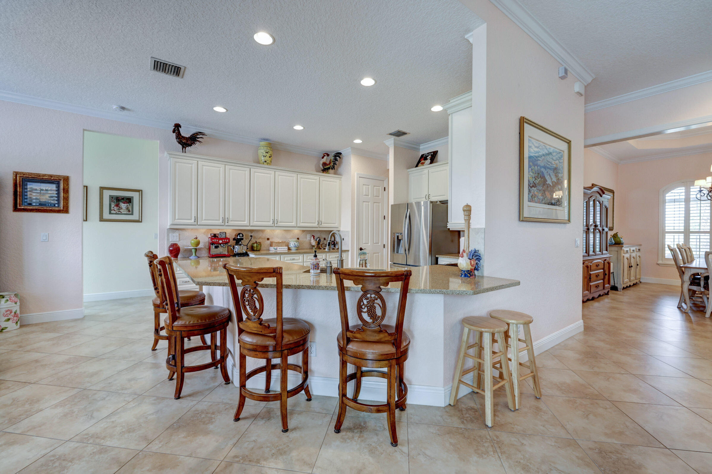 571 Southeast Tres Belle Circle Stuart, FL 34997 - Photo 11 of 54 a view of a dining area with furniture
