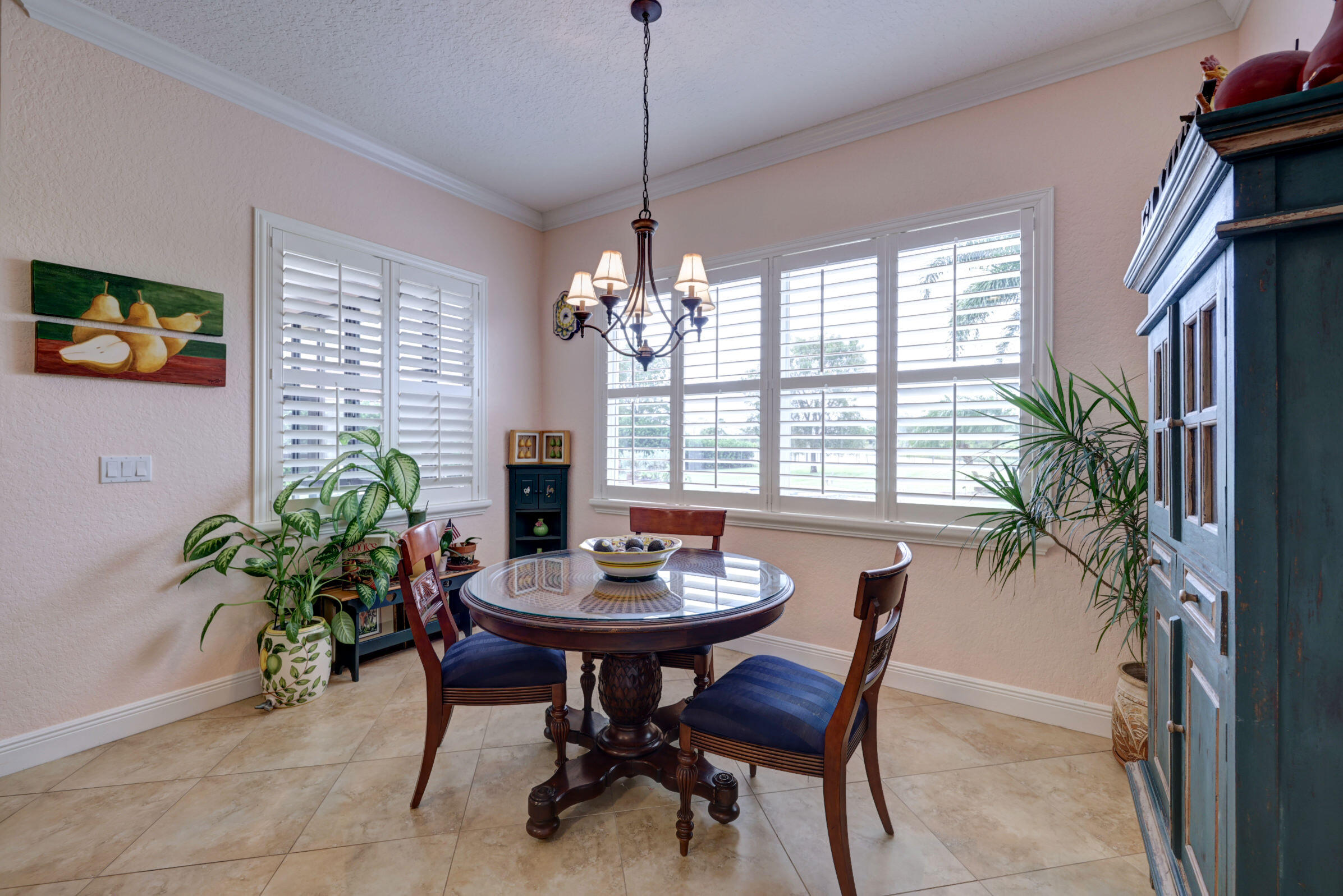 571 Southeast Tres Belle Circle Stuart, FL 34997 - Photo 15 of 54 a view of a dining room with furniture window and wooden floor
