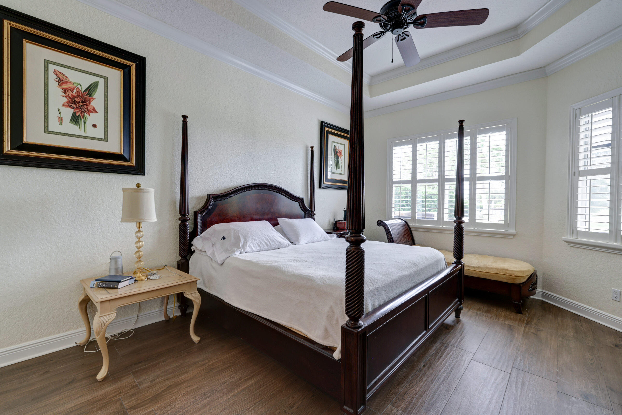 571 Southeast Tres Belle Circle Stuart, FL 34997 - Photo 23 of 54 a bedroom with a bed and a table