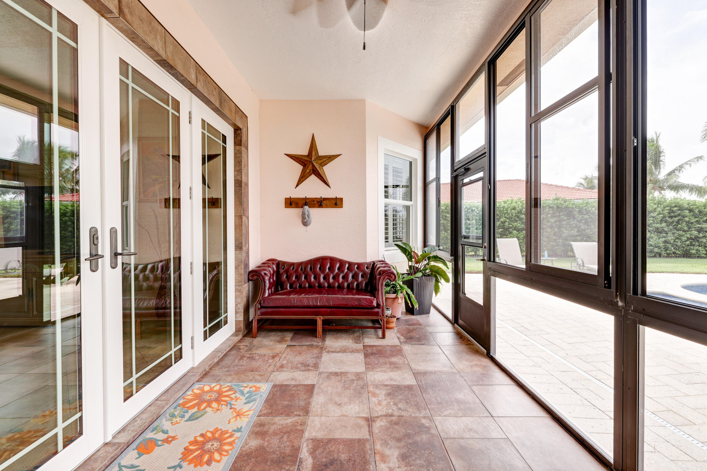 571 Southeast Tres Belle Circle Stuart, FL 34997 - Photo 30 of 54 a view of a hallway with furniture and a rug