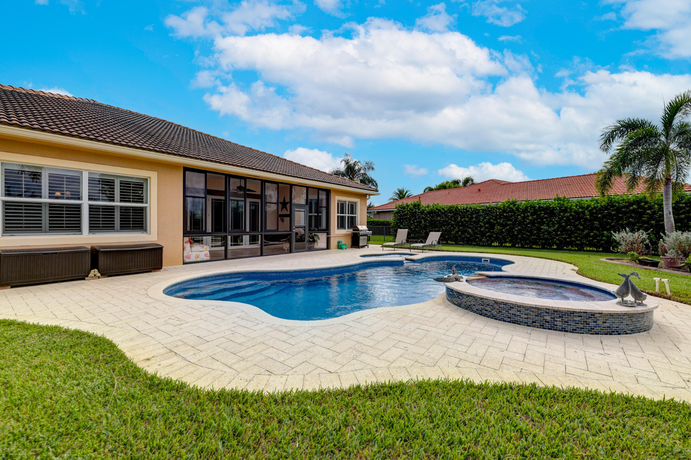 571 Southeast Tres Belle Circle Stuart, FL 34997 - Photo 36 of 54 a view of a house with swimming pool and porch