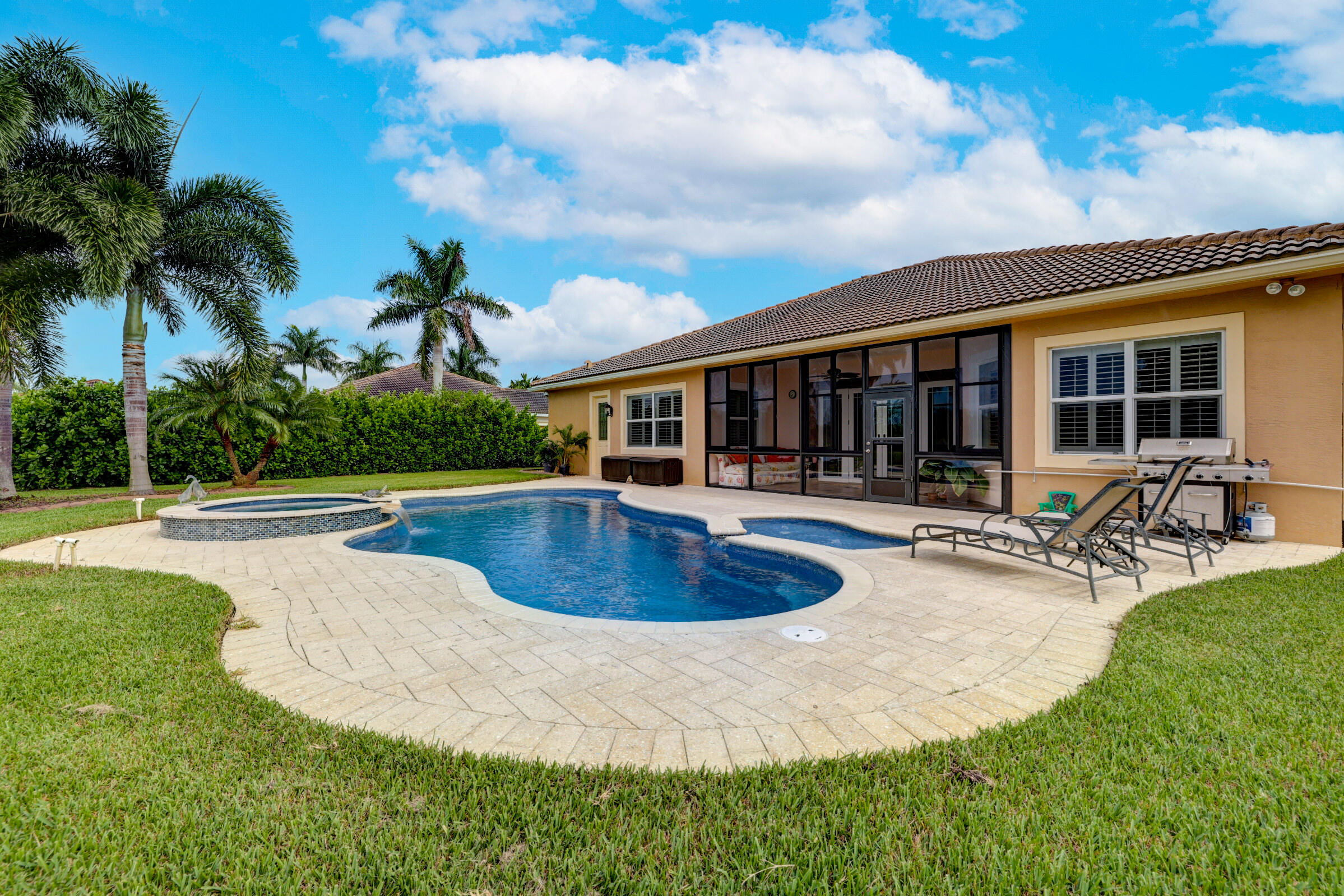 571 Southeast Tres Belle Circle Stuart, FL 34997 - Photo 37 of 54 a view of a house with swimming pool and sitting area