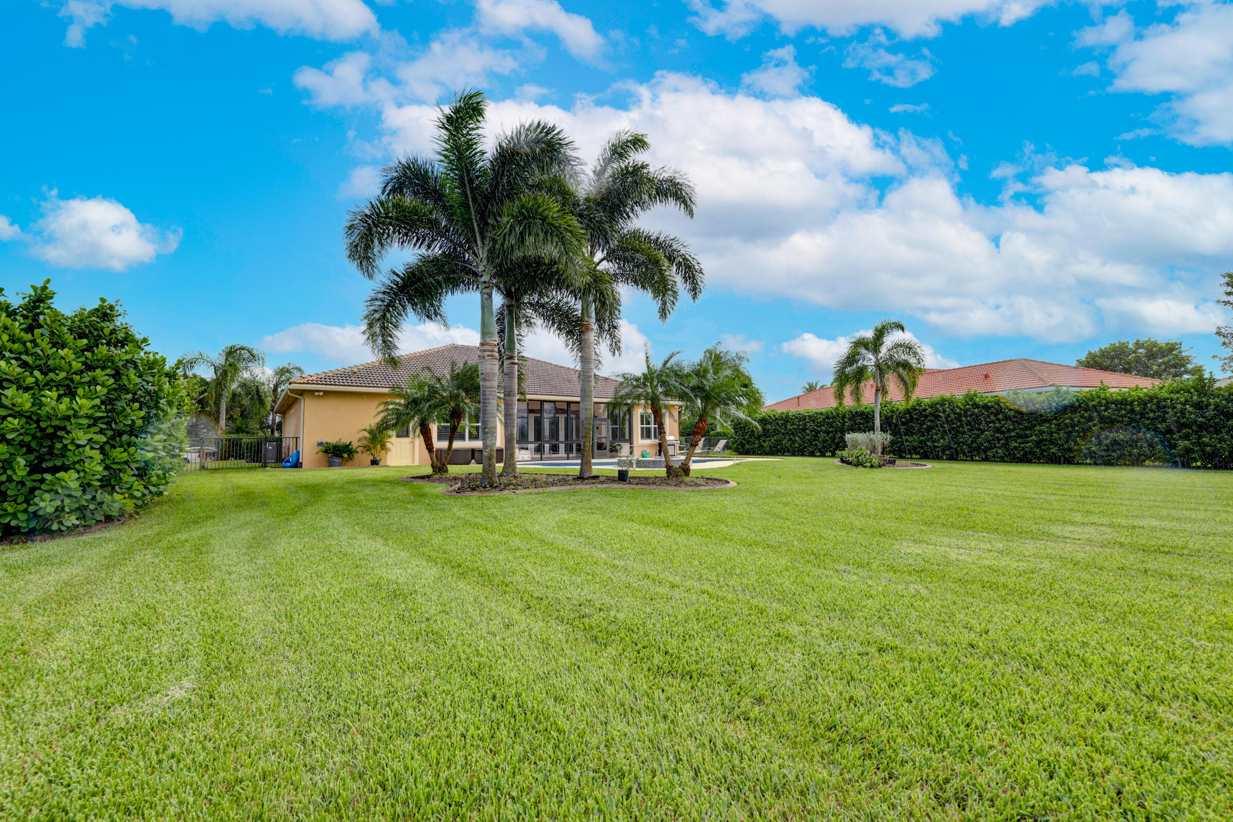 571 Southeast Tres Belle Circle Stuart, FL 34997 - Photo 41 of 54 a front view of a house with garden