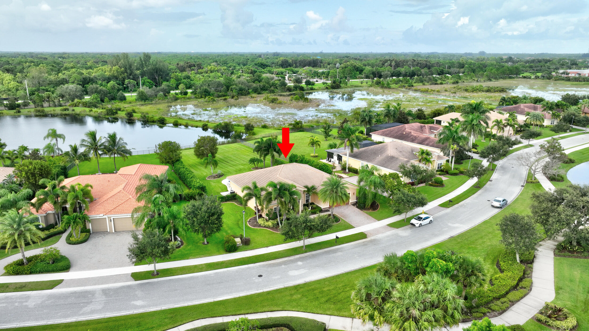 571 Southeast Tres Belle Circle Stuart, FL 34997 - Photo 47 of 54 an aerial view of lake residential houses with outdoor space and swimming pool
