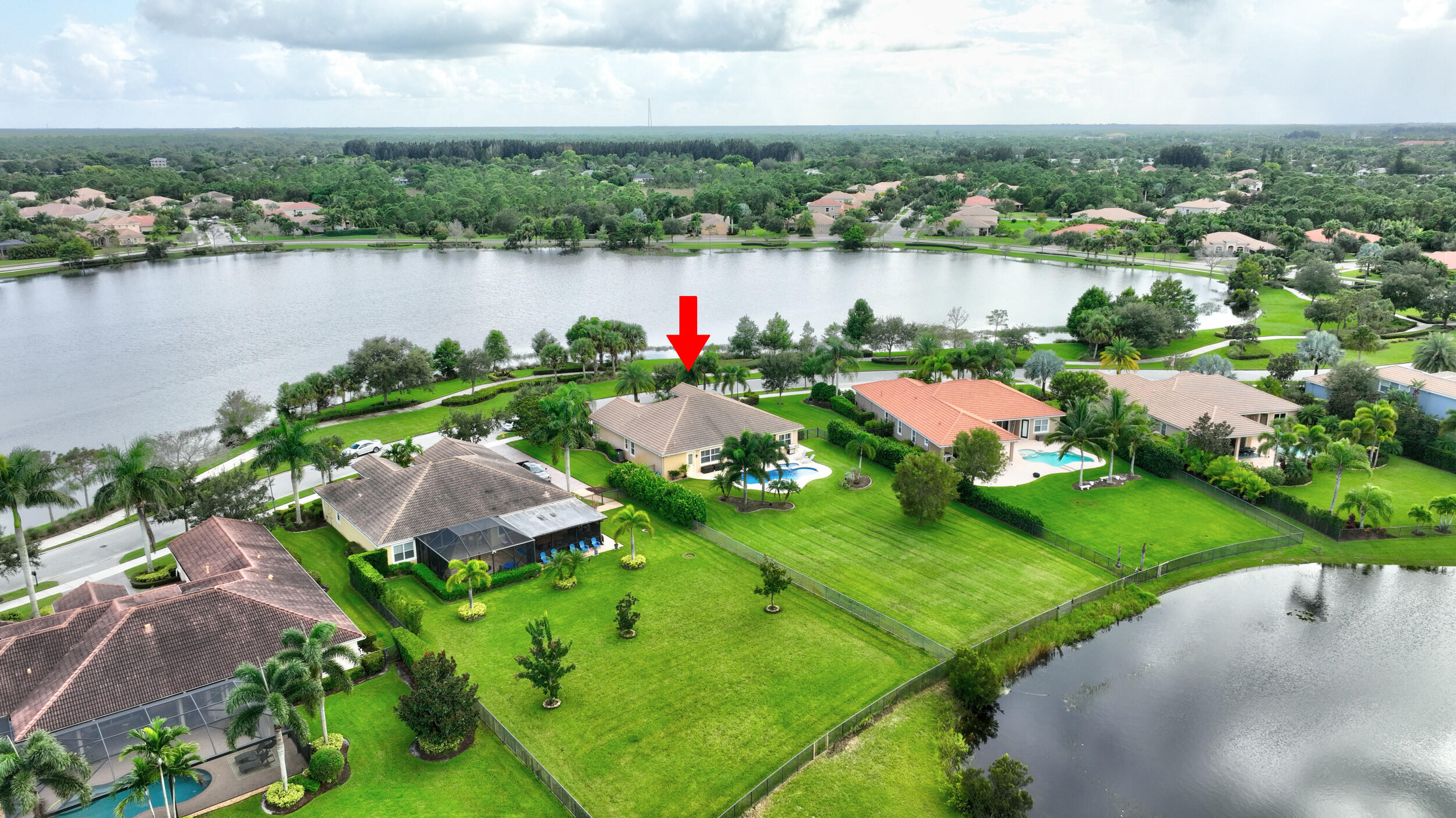 571 Southeast Tres Belle Circle Stuart, FL 34997 - Photo 50 of 54 an aerial view of lake residential houses with outdoor space and lake view