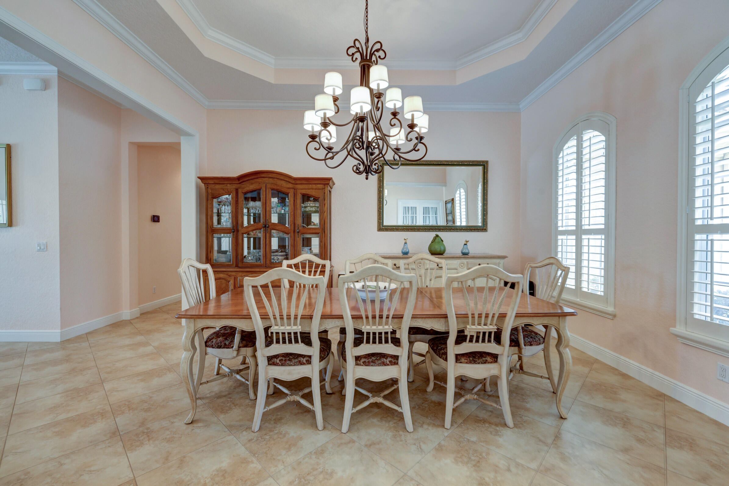 571 Southeast Tres Belle Circle Stuart, FL 34997 - Photo 5 of 54 a view of a dining room with furniture window and chandelier