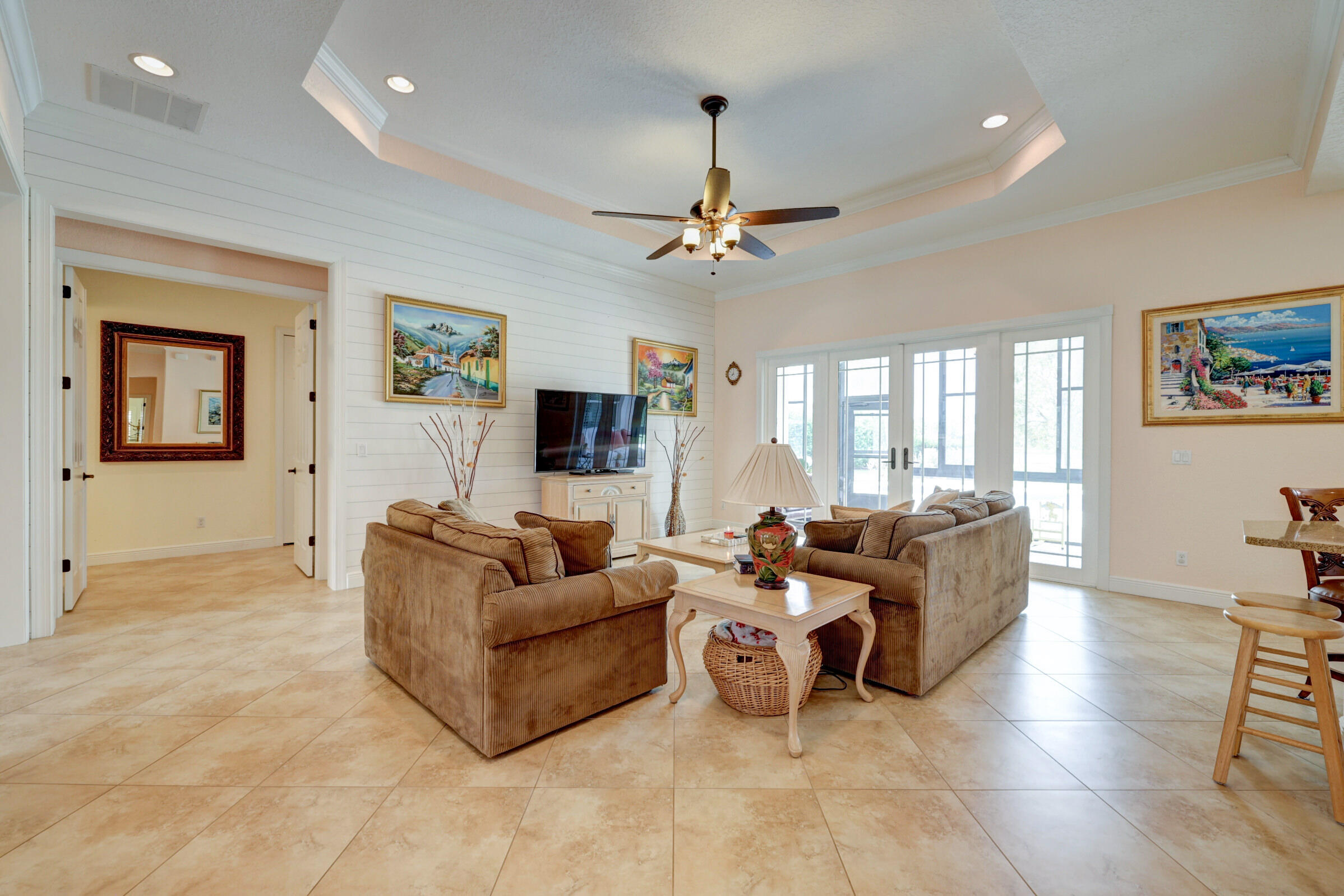571 Southeast Tres Belle Circle Stuart, FL 34997 - Photo 7 of 54 a living room with furniture and a flat screen tv