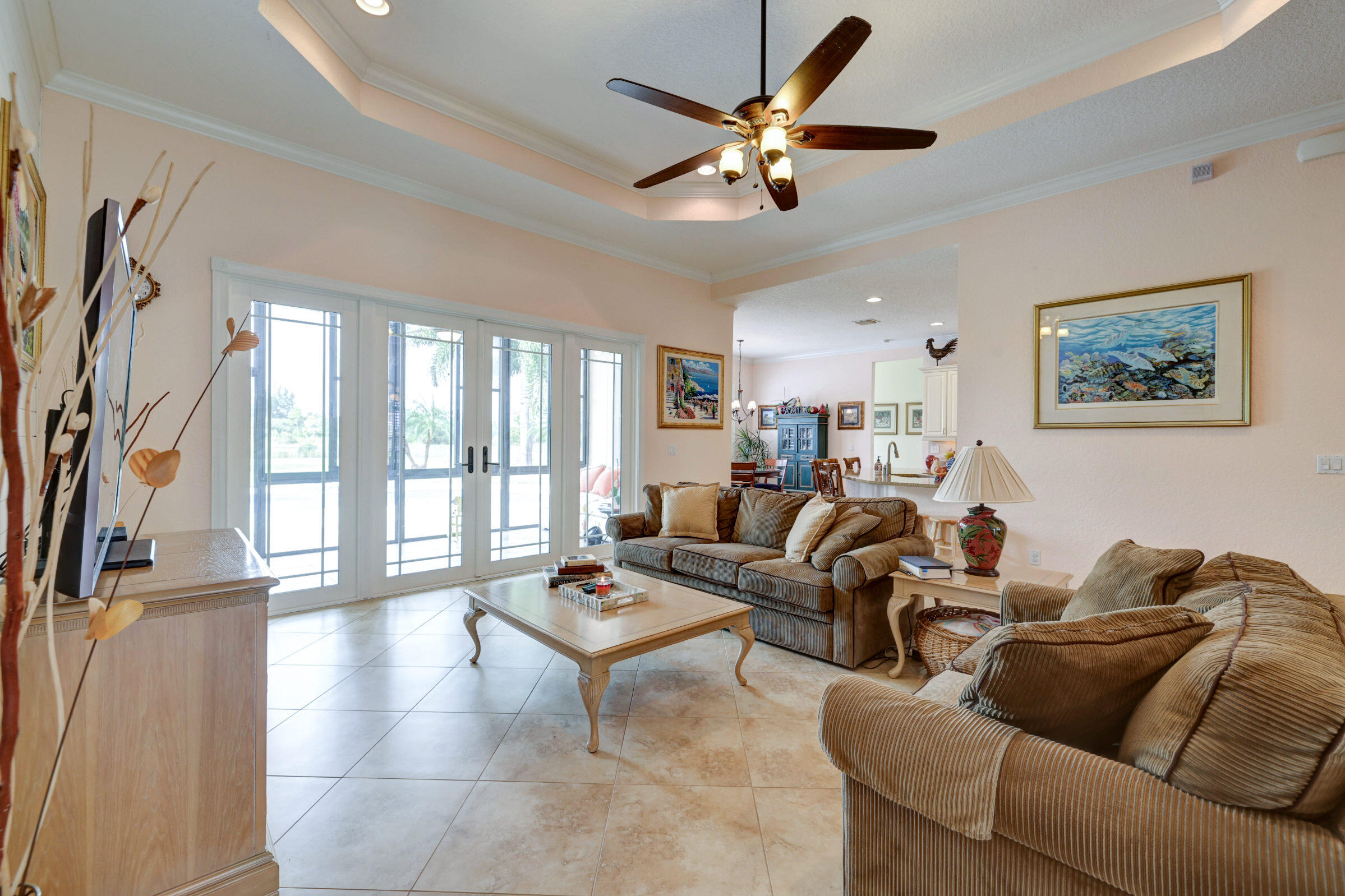 571 Southeast Tres Belle Circle Stuart, FL 34997 - Photo 8 of 54 a living room with furniture and a large window