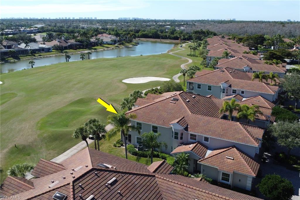 5963 Trophy Drive, Unit 2003 Naples, FL 34110 - Photo 14 of 50 Aerial view of residential area with a golf club and a nearby body of water