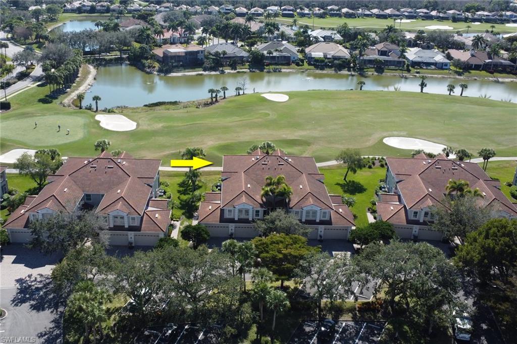 5963 Trophy Drive, Unit 2003 Naples, FL 34110 - Photo 17 of 50 Aerial view of residential area featuring a local golf course and a large body of water