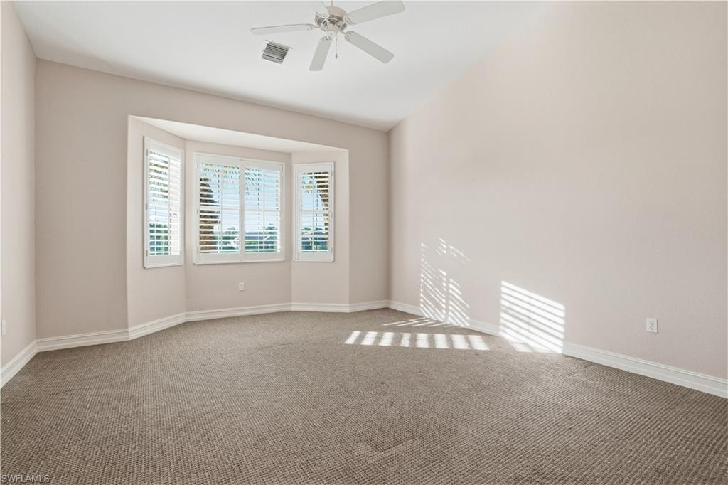 5963 Trophy Drive, Unit 2003 Naples, FL 34110 - Photo 32 of 50 Spare room with carpet and a ceiling fan