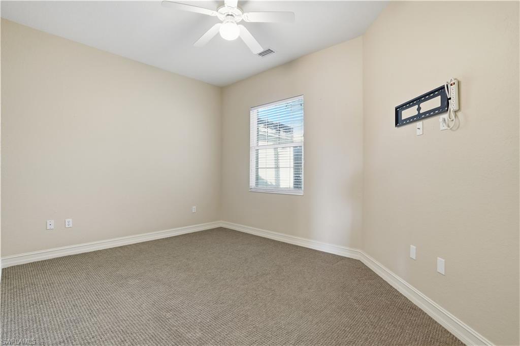 5963 Trophy Drive, Unit 2003 Naples, FL 34110 - Photo 36 of 50 Unfurnished room featuring carpet and ceiling fan