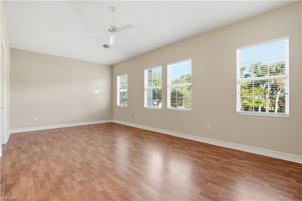 5963 Trophy Drive, Unit 2003 Naples, FL 34110 - Photo 39 of 50 Unfurnished room with light wood-type flooring, ceiling fan, and lofted ceiling