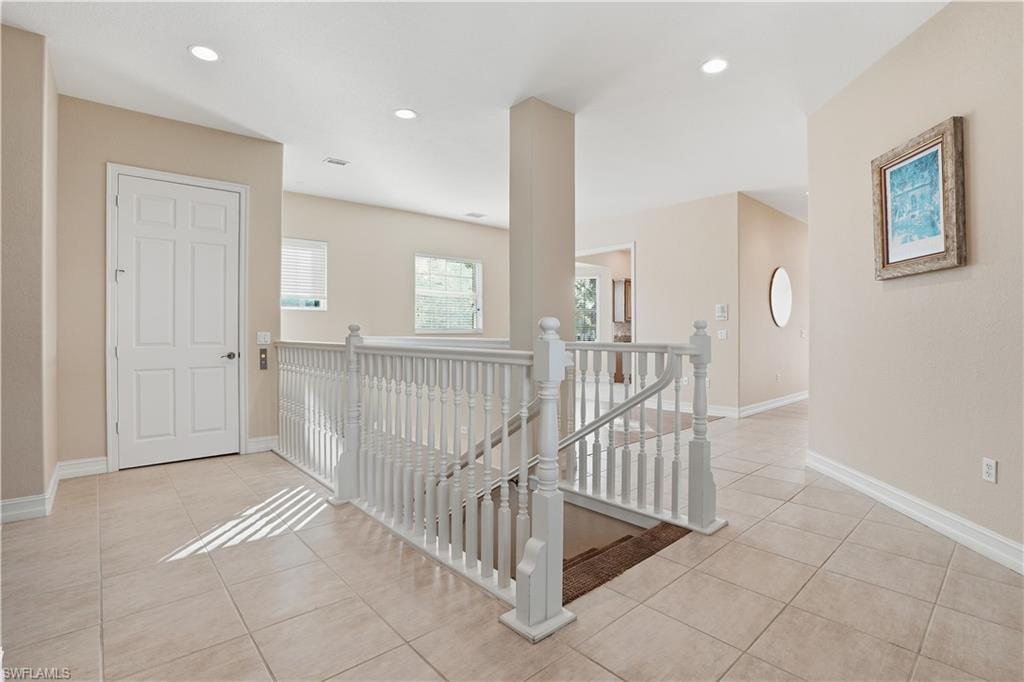 5963 Trophy Drive, Unit 2003 Naples, FL 34110 - Photo 42 of 50 Corridor featuring an upstairs landing, light tile patterned floors, and recessed lighting