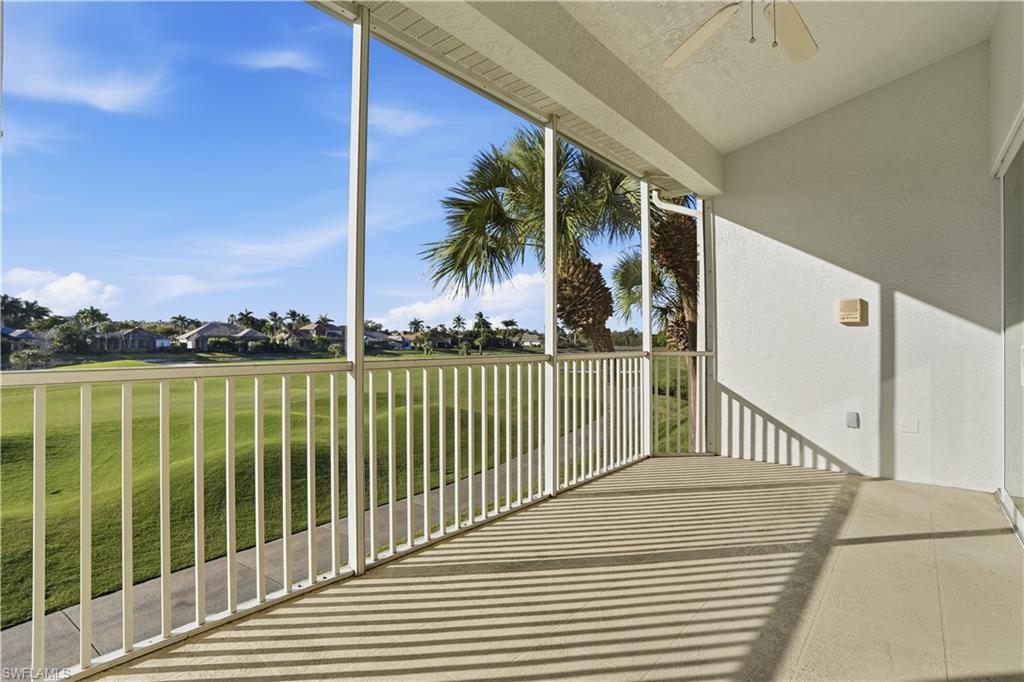 5963 Trophy Drive, Unit 2003 Naples, FL 34110 - Photo 47 of 50 Balcony featuring a residential view, a sunroom, and ceiling fan