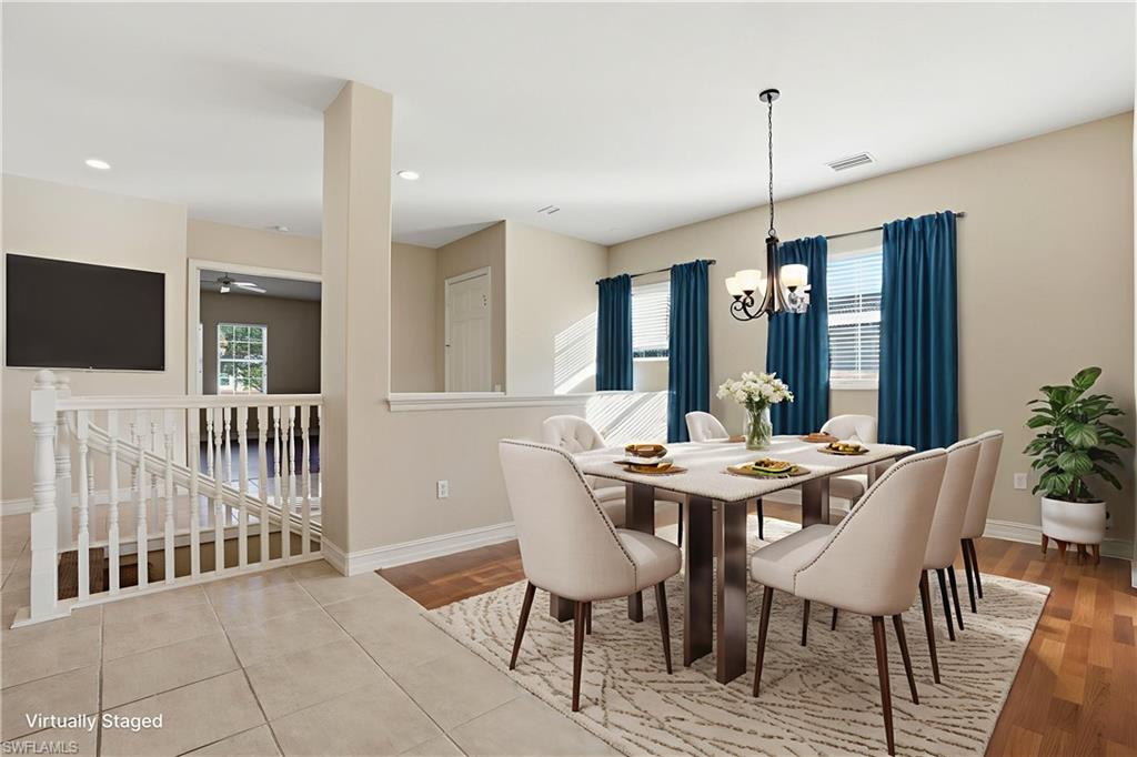 5963 Trophy Drive, Unit 2003 Naples, FL 34110 - Photo 5 of 50 Dining area featuring light wood-type flooring, recessed lighting, and a chandelier