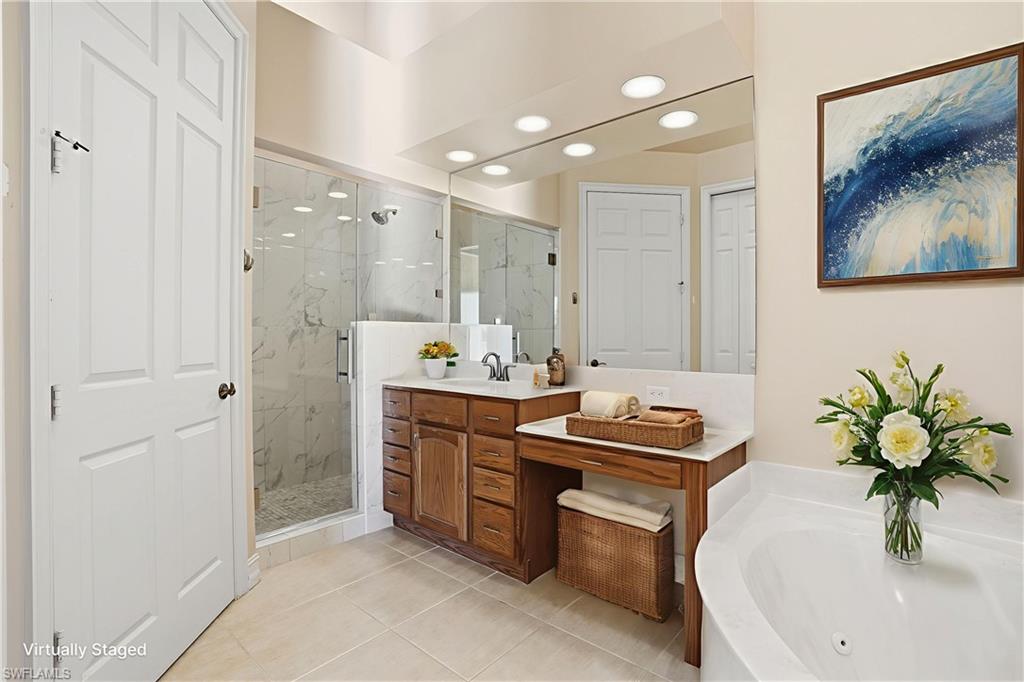 5963 Trophy Drive, Unit 2003 Naples, FL 34110 - Photo 7 of 50 Bathroom featuring recessed lighting, a marble finish shower, vanity, a jetted tub, and light tile patterned flooring