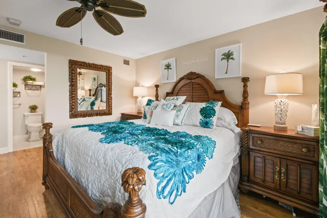 a bedroom with a bed dresser and a window