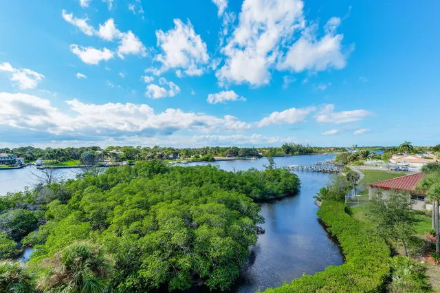 an aerial view of a residential houses with outdoor space and street view