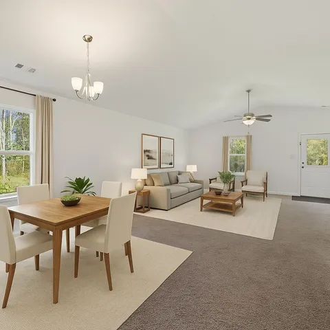 a living room with furniture and a table