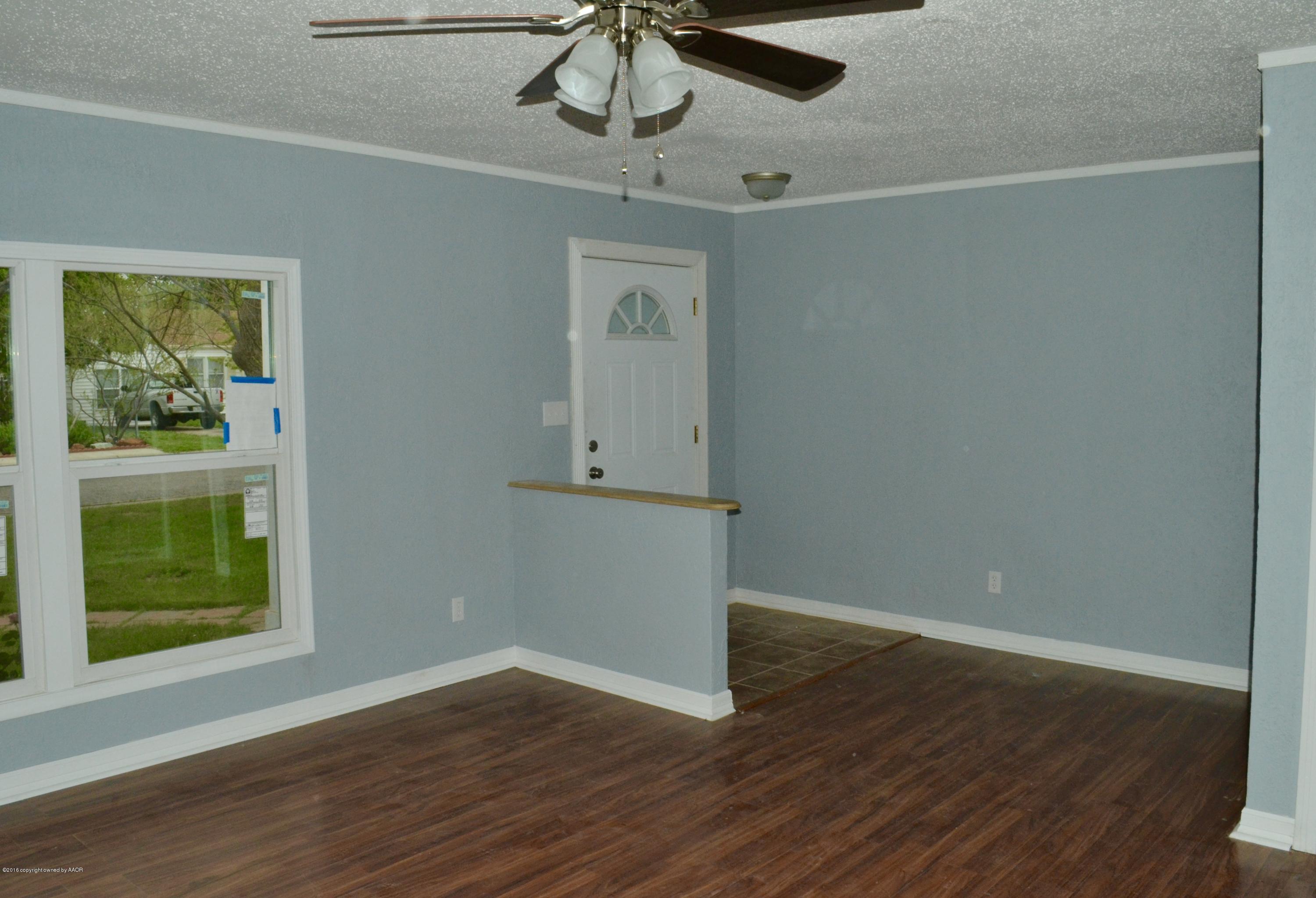 4004 South Lipscomb Street Amarillo, TX 79110 - Photo 3 of 49 a view of a room with wooden floor closet and windows
