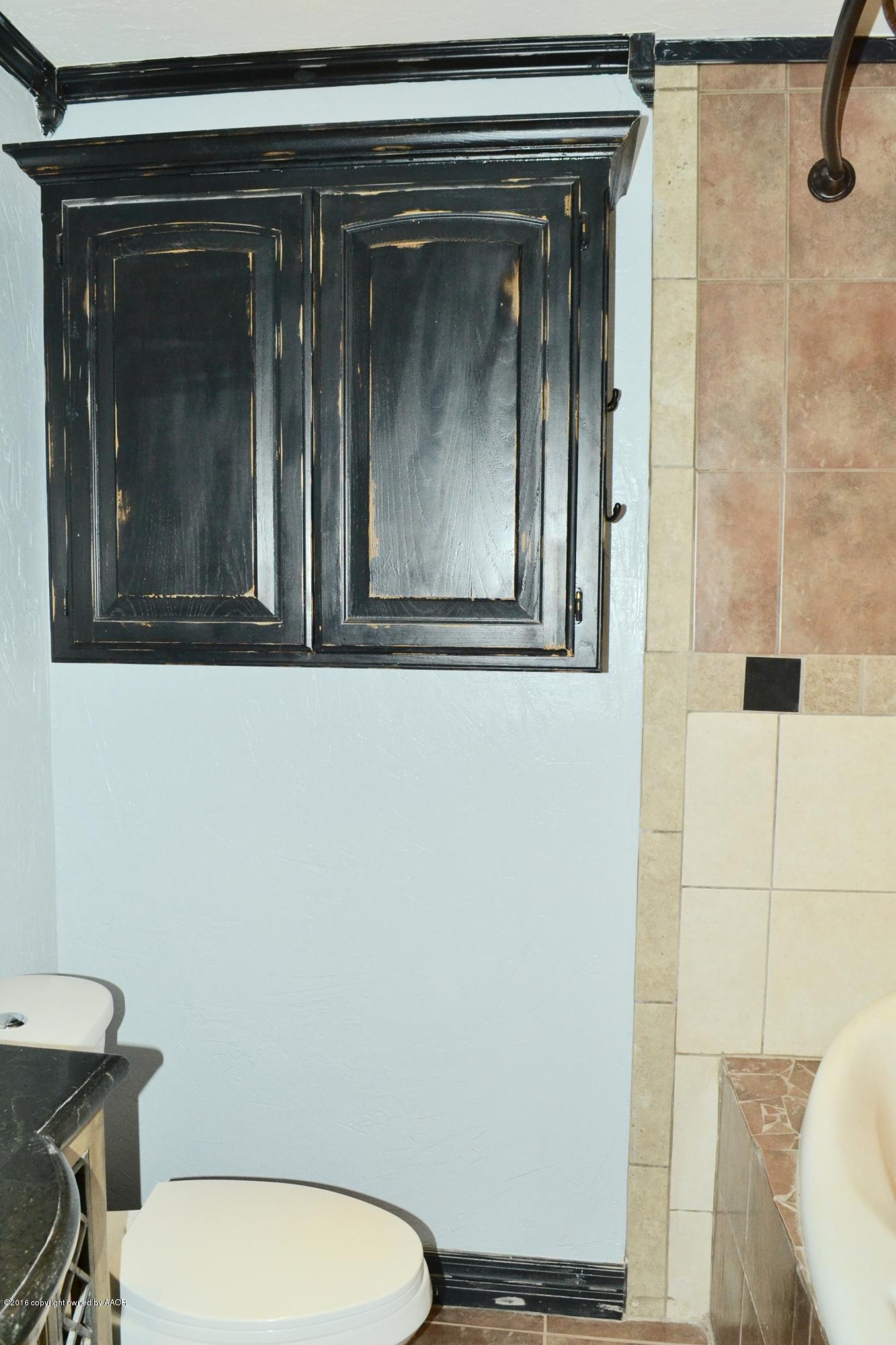 4004 South Lipscomb Street Amarillo, TX 79110 - Photo 36 of 49 a bathroom with a toilet and a sink