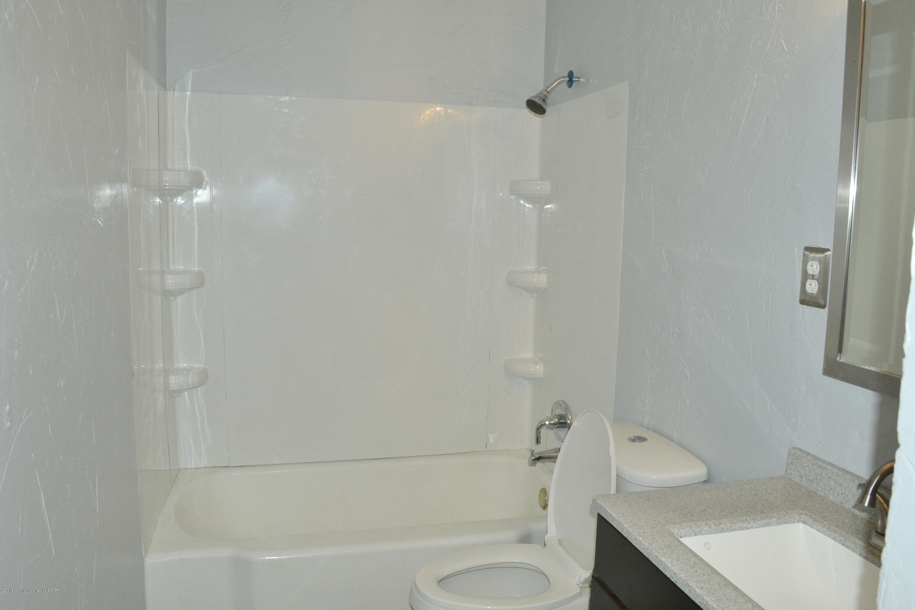 4004 South Lipscomb Street Amarillo, TX 79110 - Photo 42 of 49 a bathroom with a sink toilet and shower