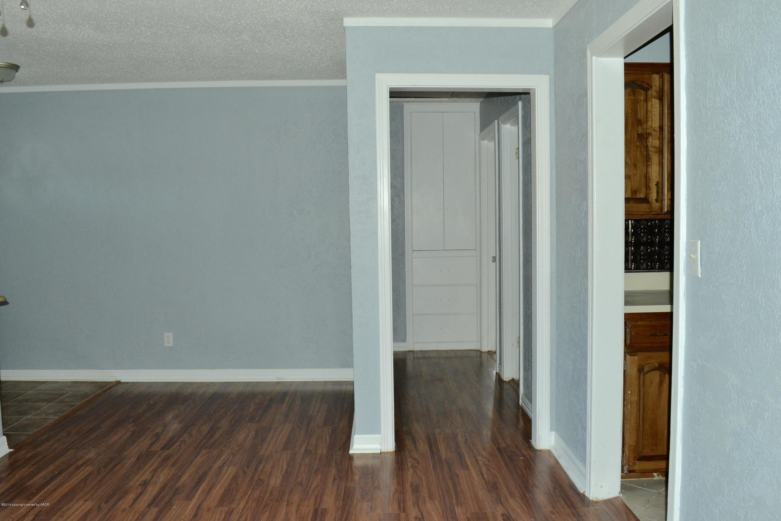 4004 South Lipscomb Street Amarillo, TX 79110 - Photo 49 of 49 a view of a hallway with wooden floor