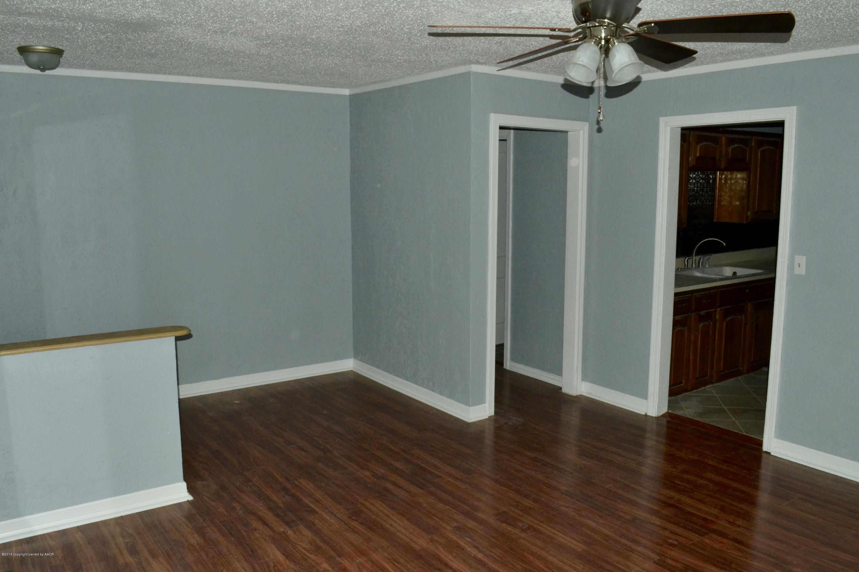 4004 South Lipscomb Street Amarillo, TX 79110 - Photo 5 of 49 a view of an empty room with wooden floor
