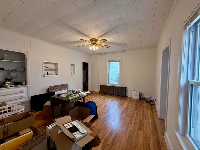 a room with furniture and wooden floor
