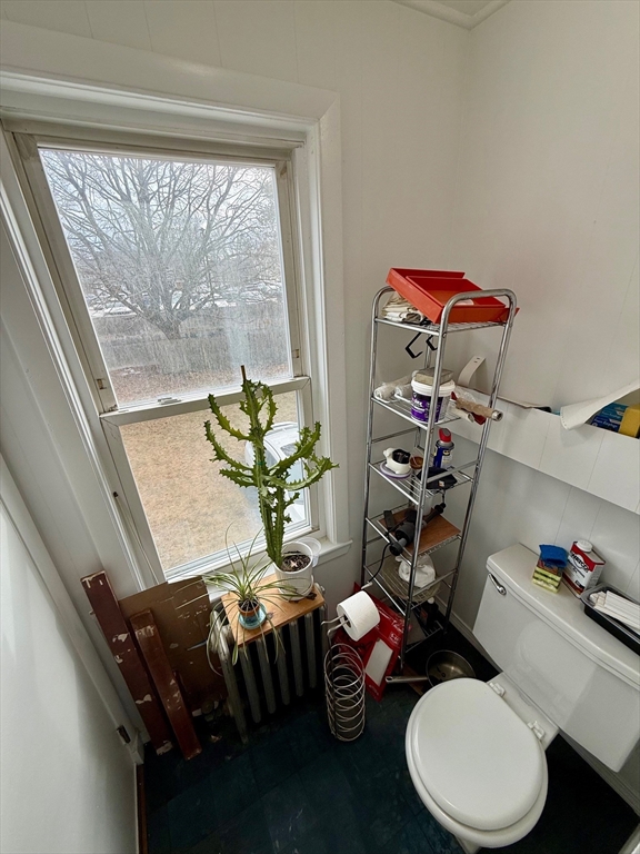 56 Lincoln Road, Unit 56 Newton, MA 02458 - Photo 8 of 10 a living room with furniture and a floor to ceiling window