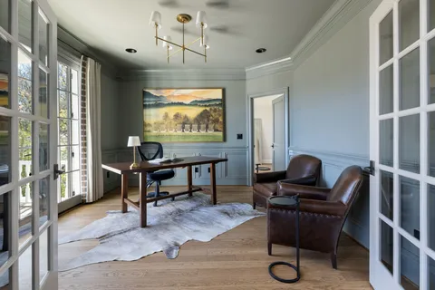 a dining room with furniture window wooden floor