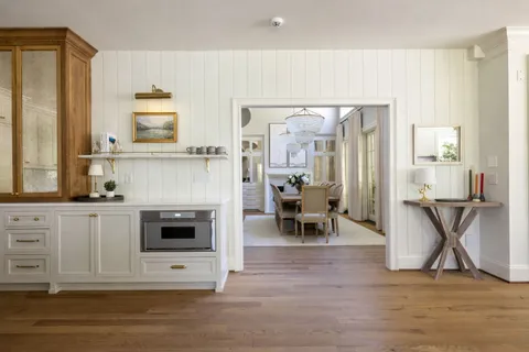 a spacious bedroom with a bed and a large window