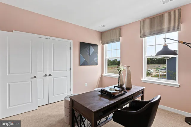 a living room with furniture and window