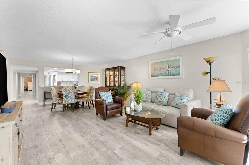 16332 Gulf Boulevard, Unit 2B Redington Beach, FL 33708 - Photo 15 of 60 a living room with furniture and wooden floor