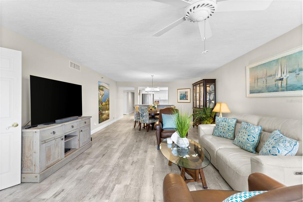 16332 Gulf Boulevard, Unit 2B Redington Beach, FL 33708 - Photo 16 of 60 a living room with furniture and a flat screen tv