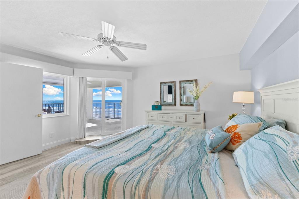16332 Gulf Boulevard, Unit 2B Redington Beach, FL 33708 - Photo 26 of 60 a bedroom with a bed and window