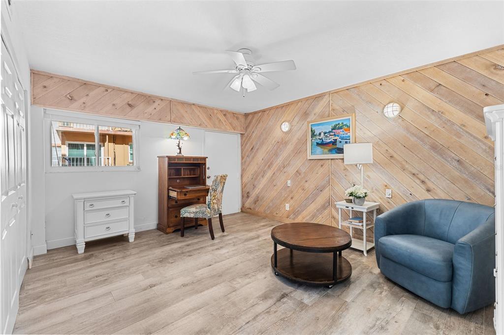 16332 Gulf Boulevard, Unit 2B Redington Beach, FL 33708 - Photo 32 of 60 a living room with furniture and a wooden floor