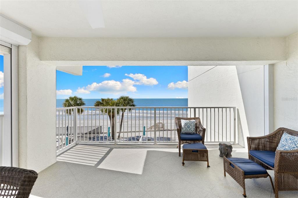 16332 Gulf Boulevard, Unit 2B Redington Beach, FL 33708 - Photo 36 of 60 a balcony with furniture and lamp