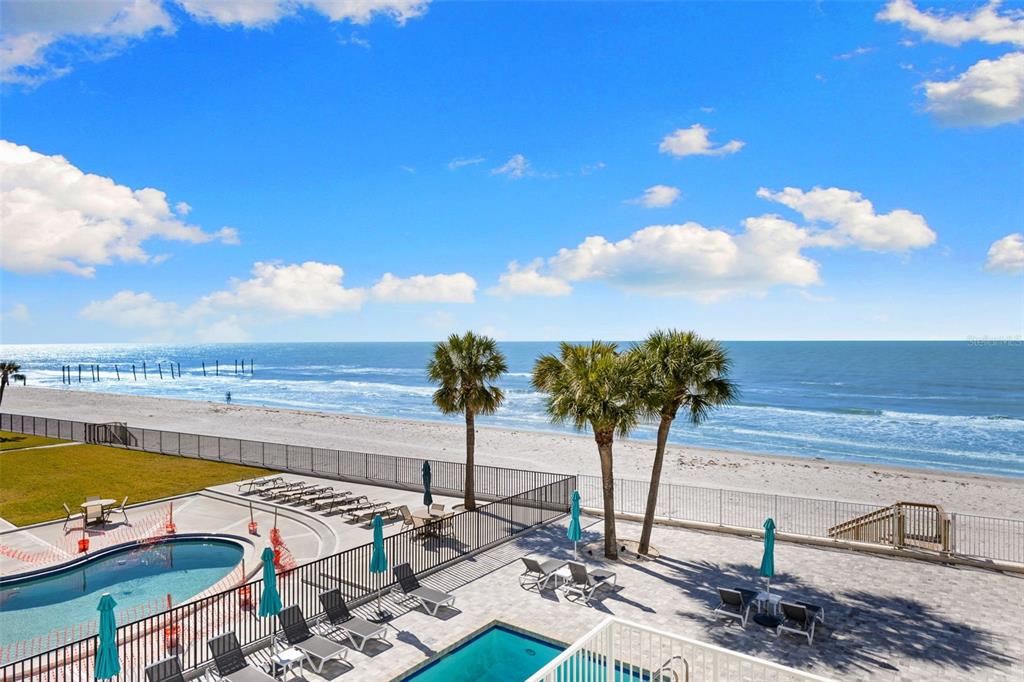16332 Gulf Boulevard, Unit 2B Redington Beach, FL 33708 - Photo 43 of 60 a view of a swimming pool with a terrace
