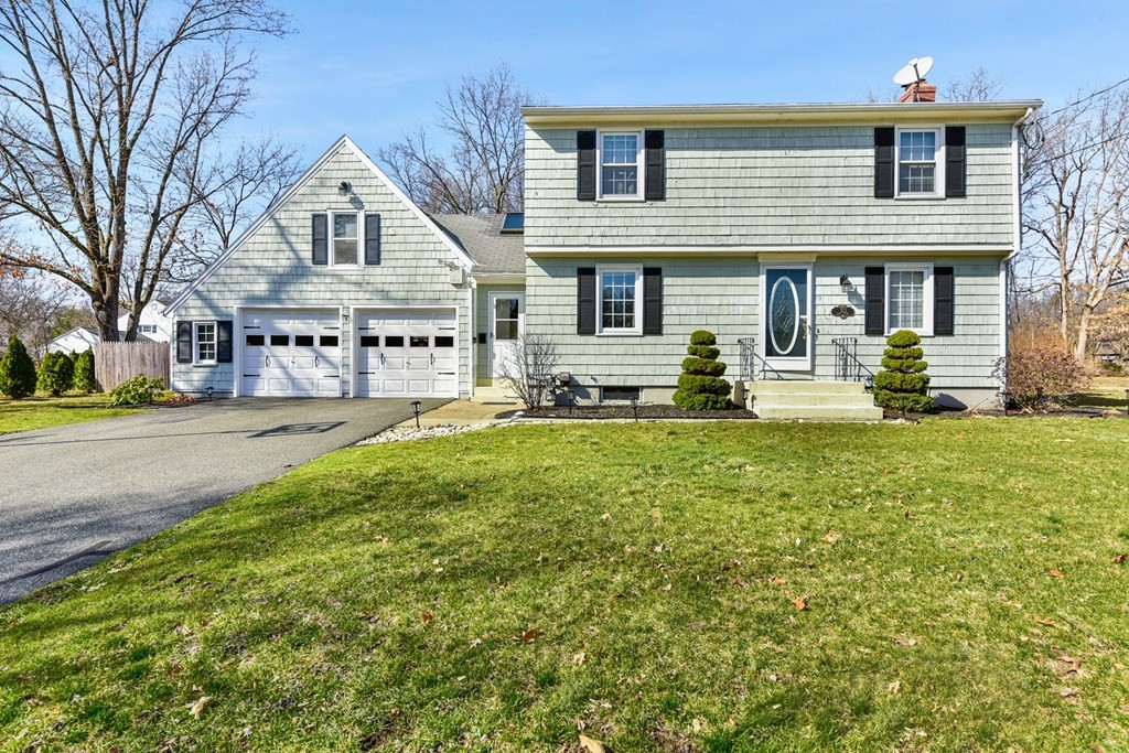 322 Wolf Swamp Road Longmeadow, MA 01106 - Photo 1 of 24 a front view of a residential apartment building with a yard