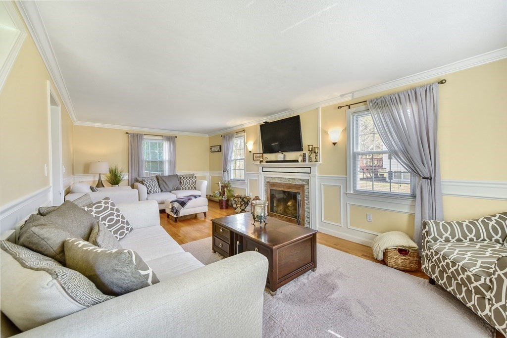 322 Wolf Swamp Road Longmeadow, MA 01106 - Photo 12 of 24 a living room with furniture fireplace and a flat screen tv