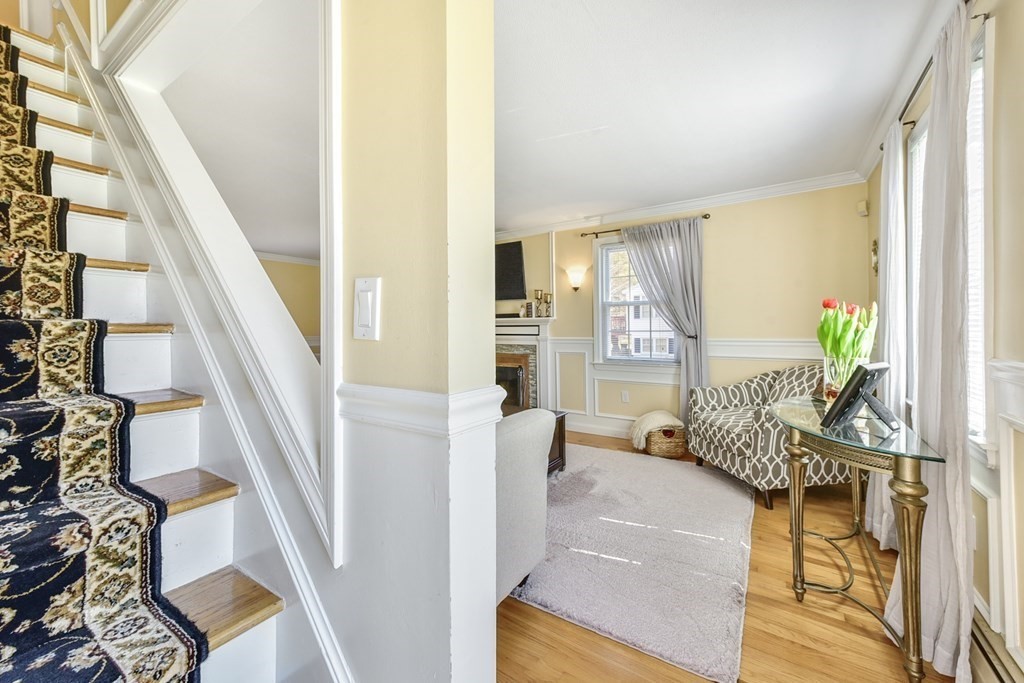 322 Wolf Swamp Road Longmeadow, MA 01106 - Photo 15 of 24 a living room with furniture and a floor to ceiling window
