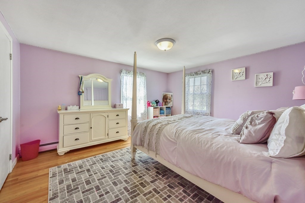 322 Wolf Swamp Road Longmeadow, MA 01106 - Photo 20 of 24 a bedroom with a bed and a mirror