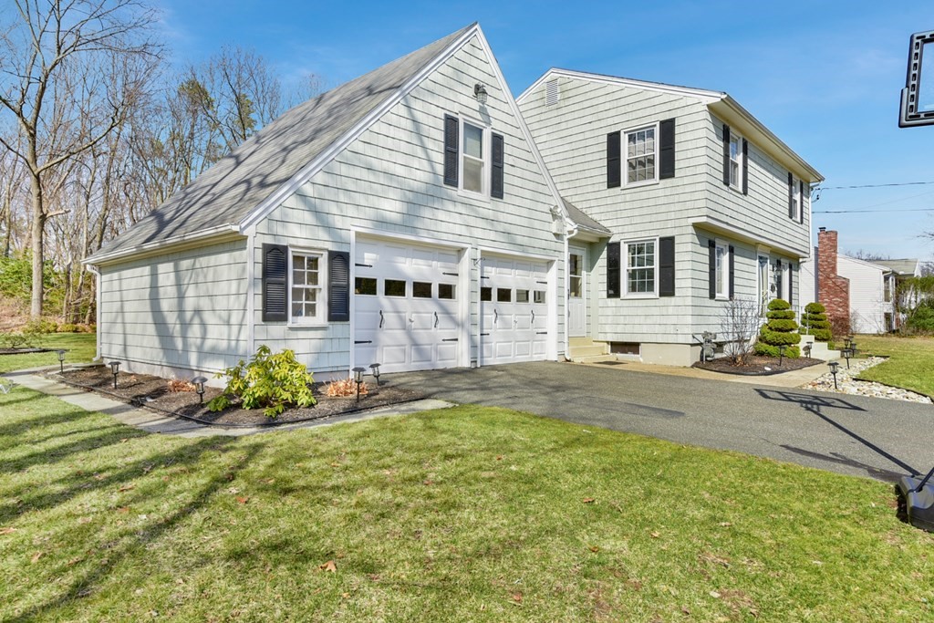 322 Wolf Swamp Road Longmeadow, MA 01106 - Photo 3 of 24 a front view of a house with a yard